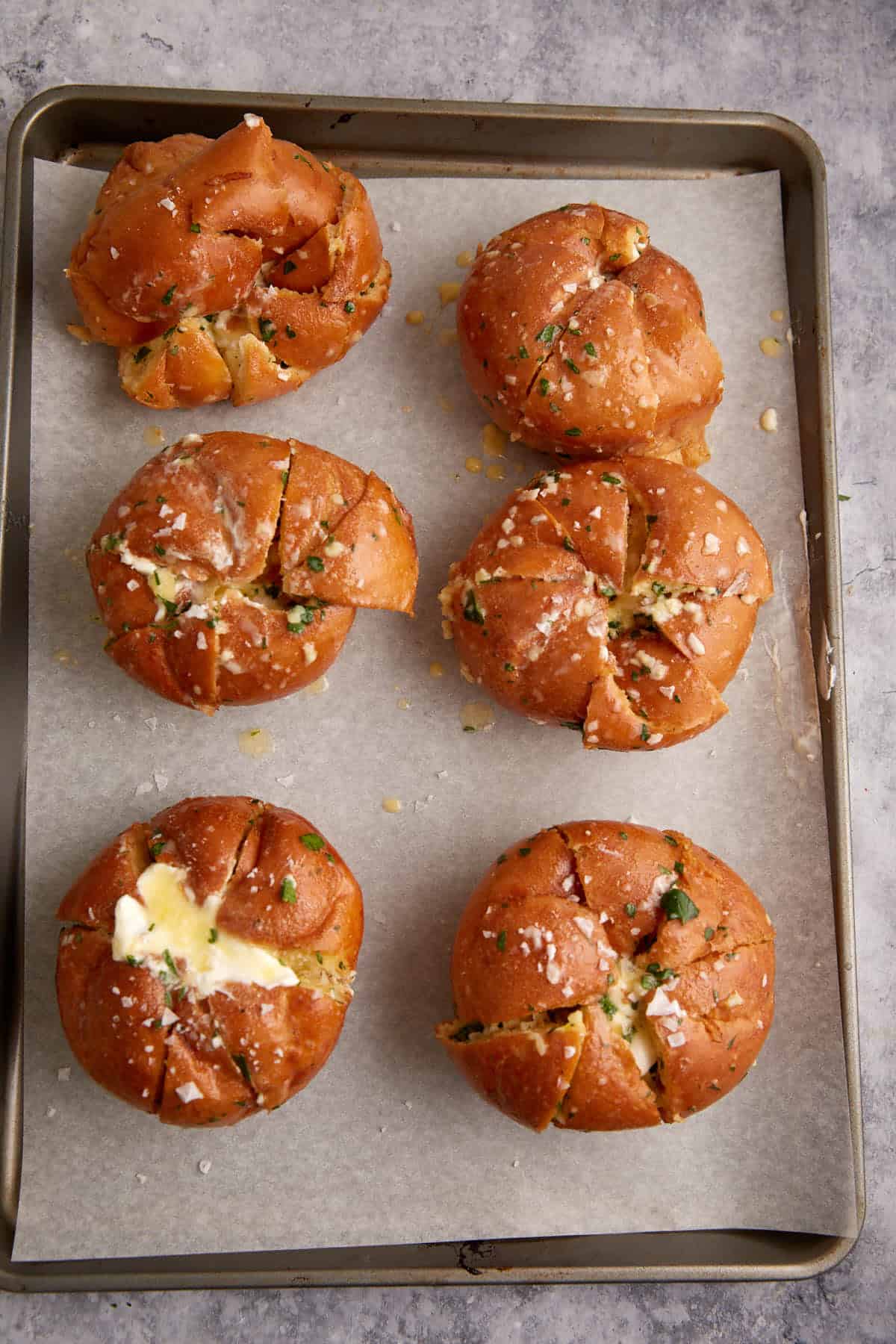Stuffed rolls on a baking sheet.