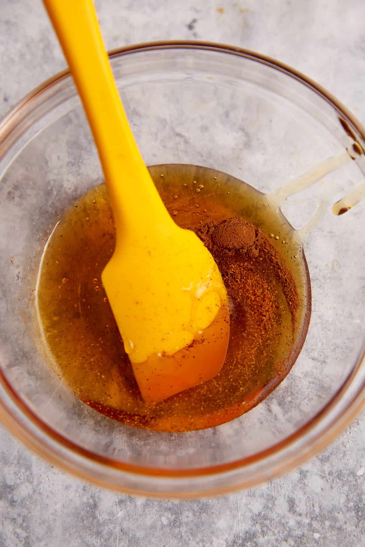 A bowl of honey and spices.