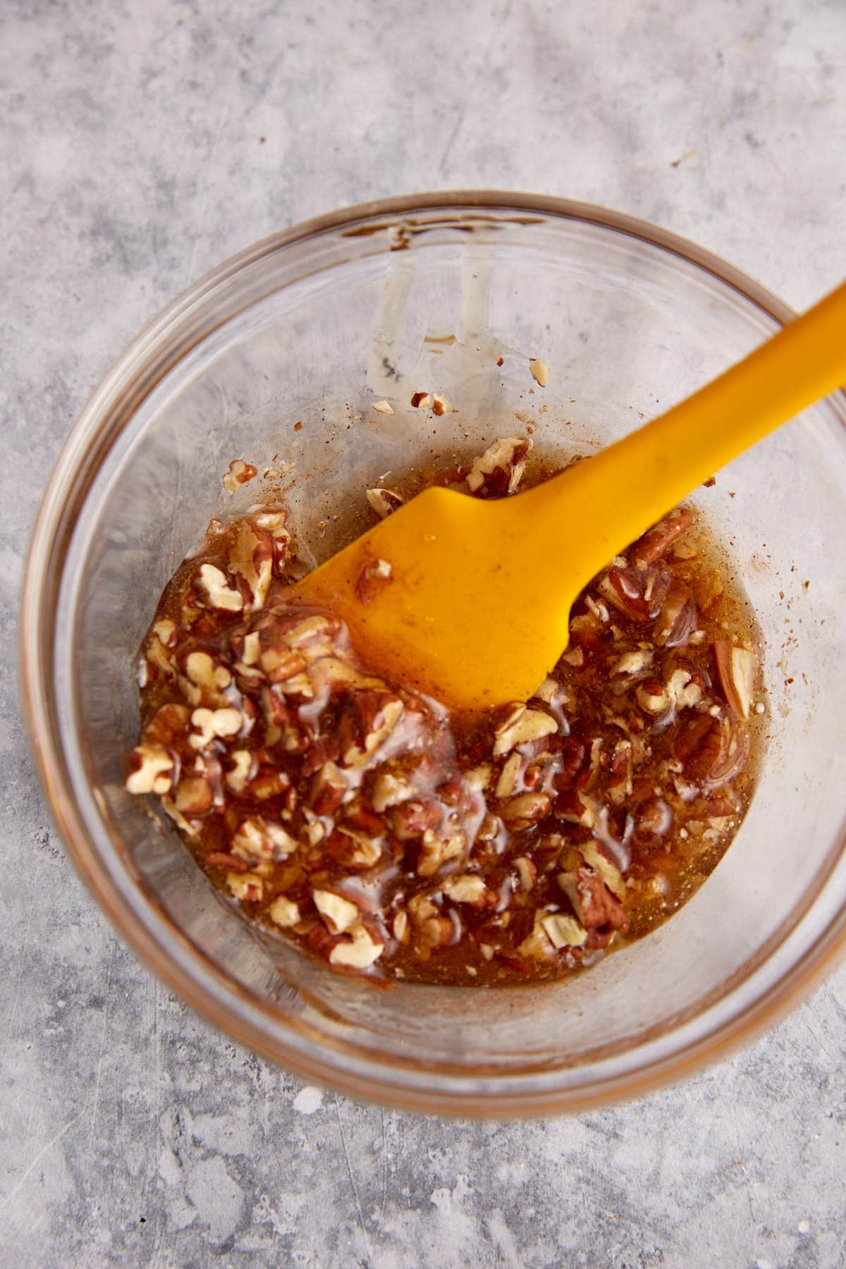 A bowl of pecan honey glaze.