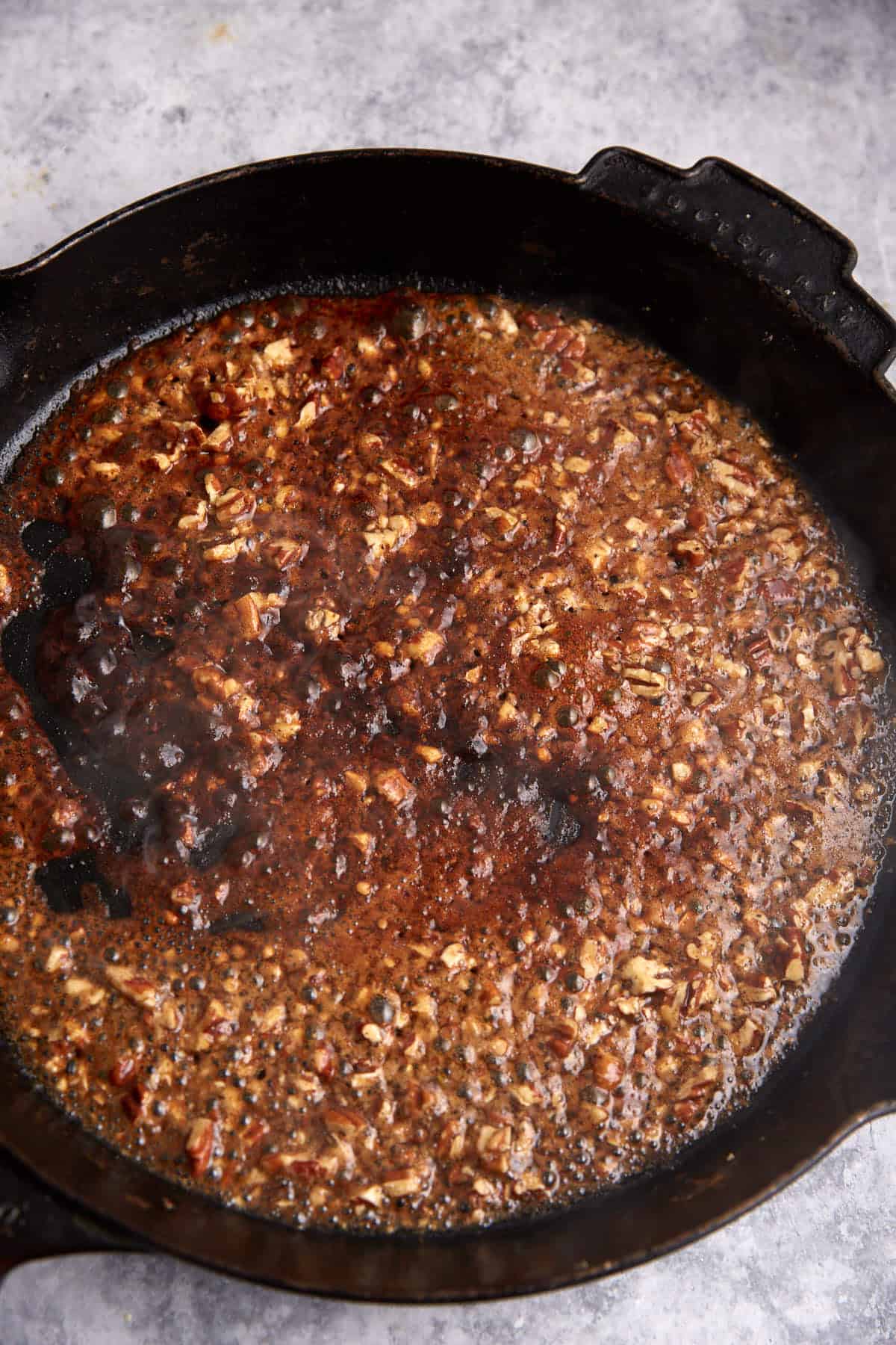A honey glaze in a skillet.
