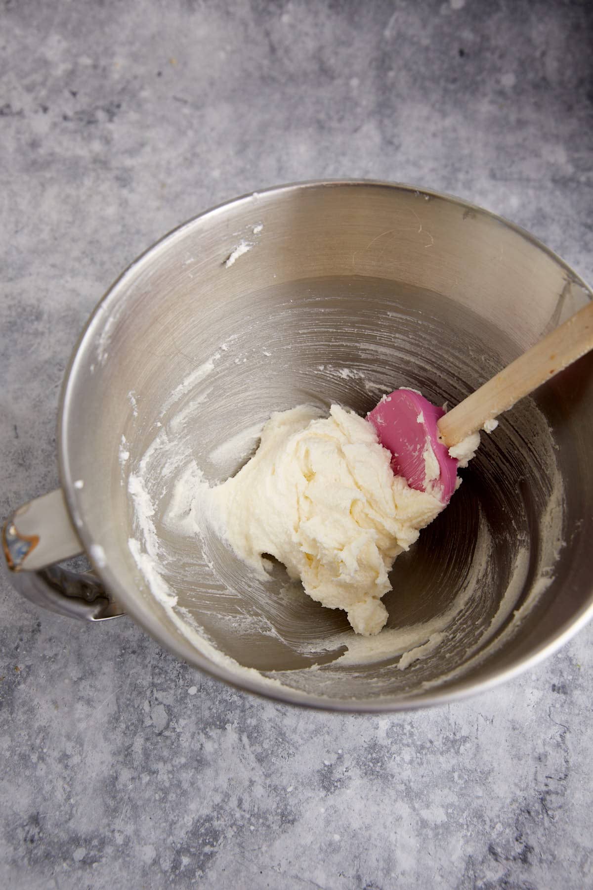 Butter and sugar creamed in a mixing bowl.