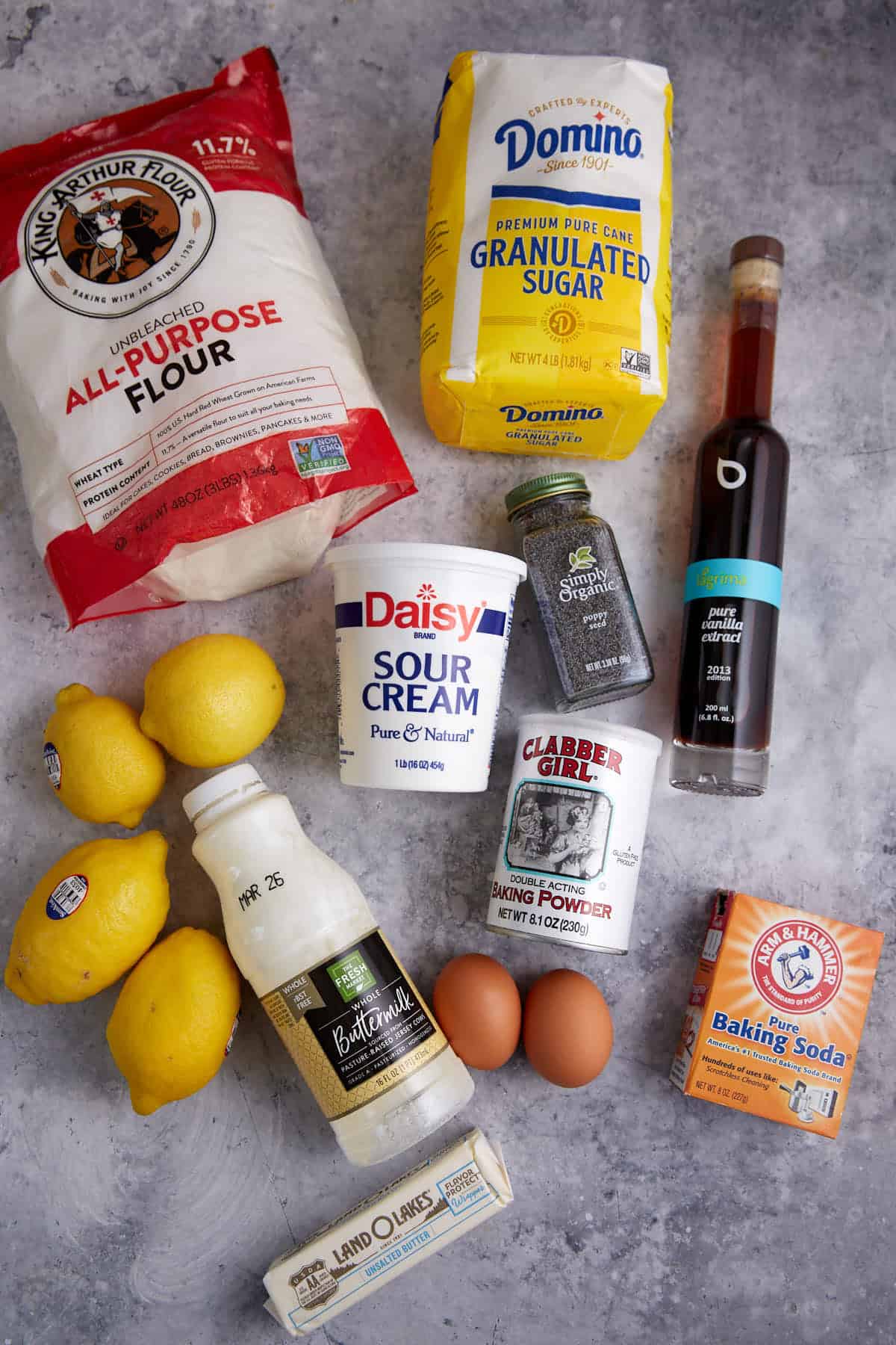 The ingredients needed to make lemon poppyseed muffins.