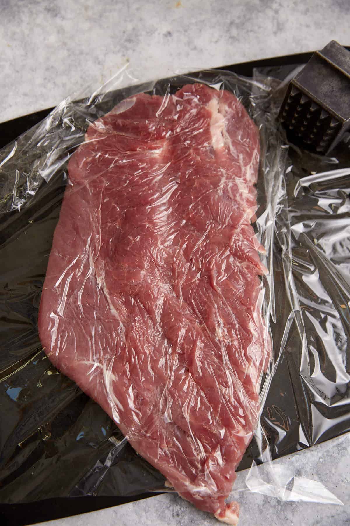A pork tenderloin pounded flat.