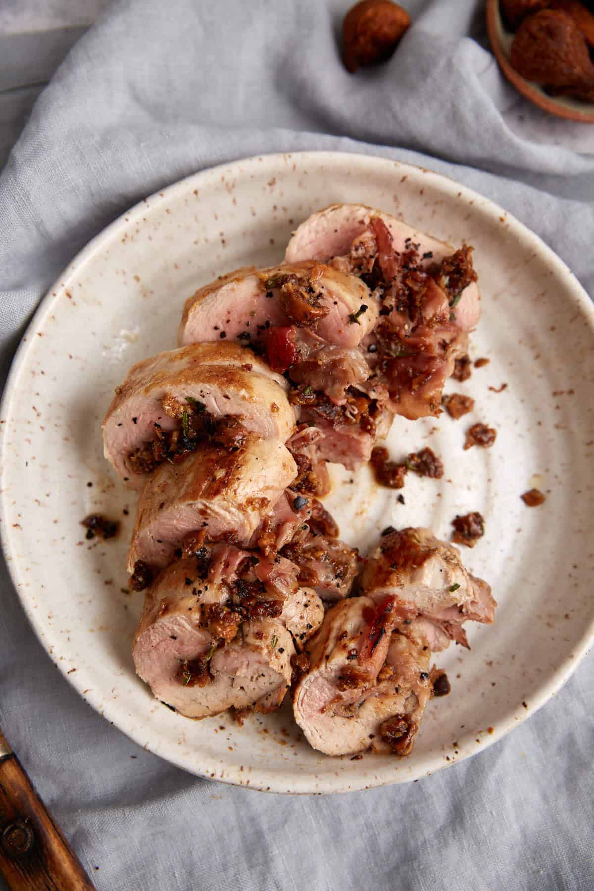 A platter of sliced pork tenderloin.