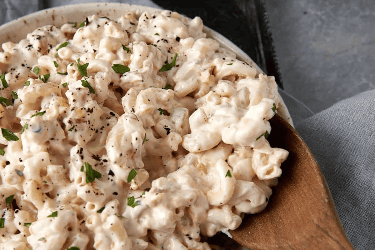 A bowl of creamy macaroni salad.