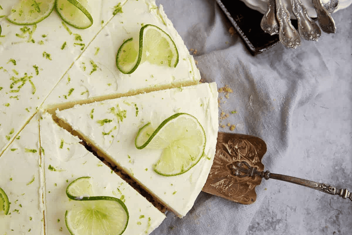 A key lime pie cut into slices.