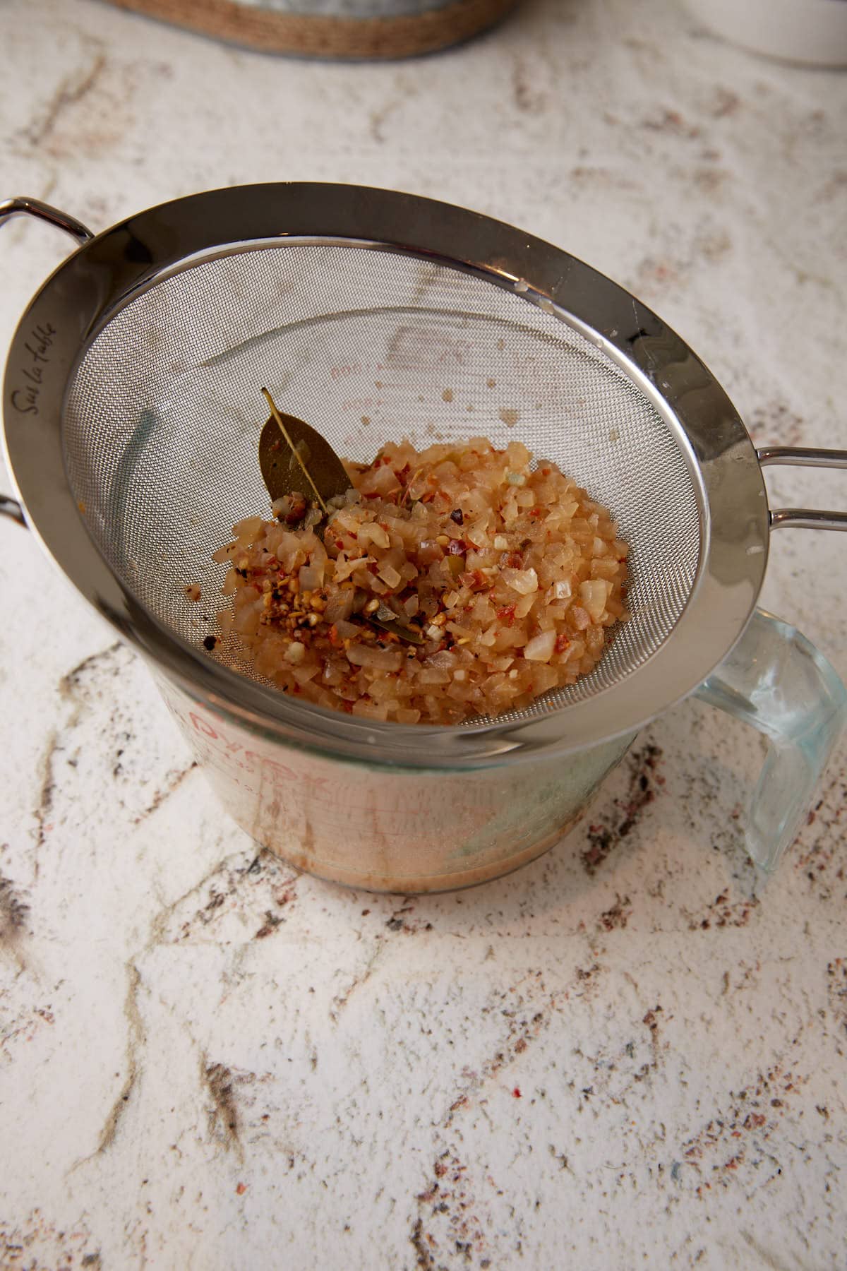 Carolina sauce poured through a sieve.
