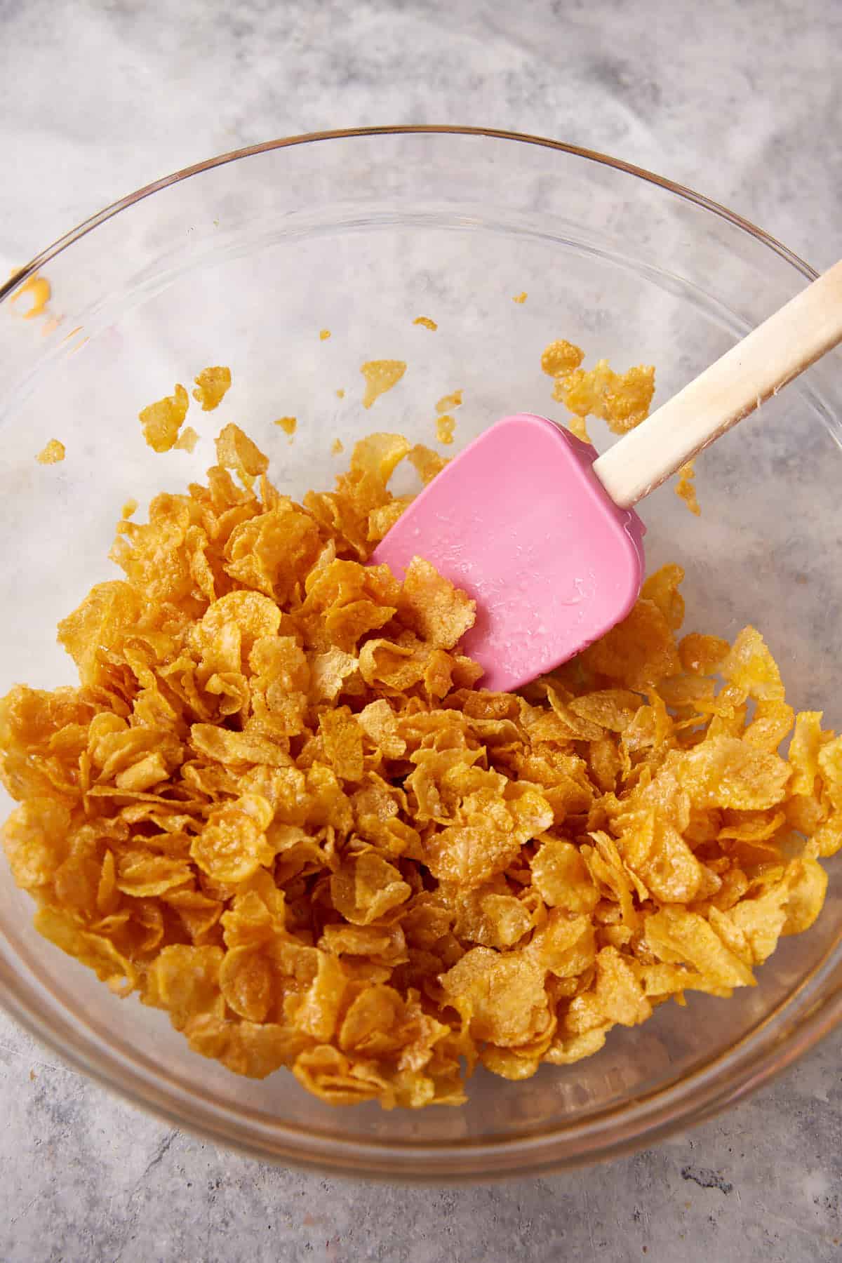 Cornflakes and butter in a bowl.