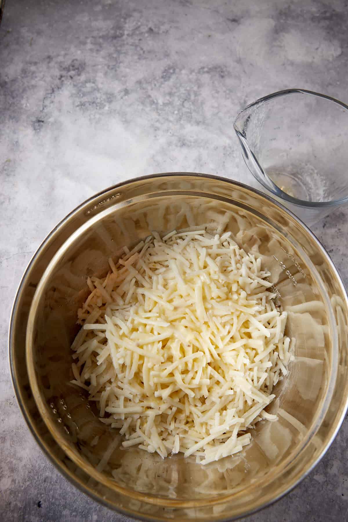 Butter poured over hasbrowns.
