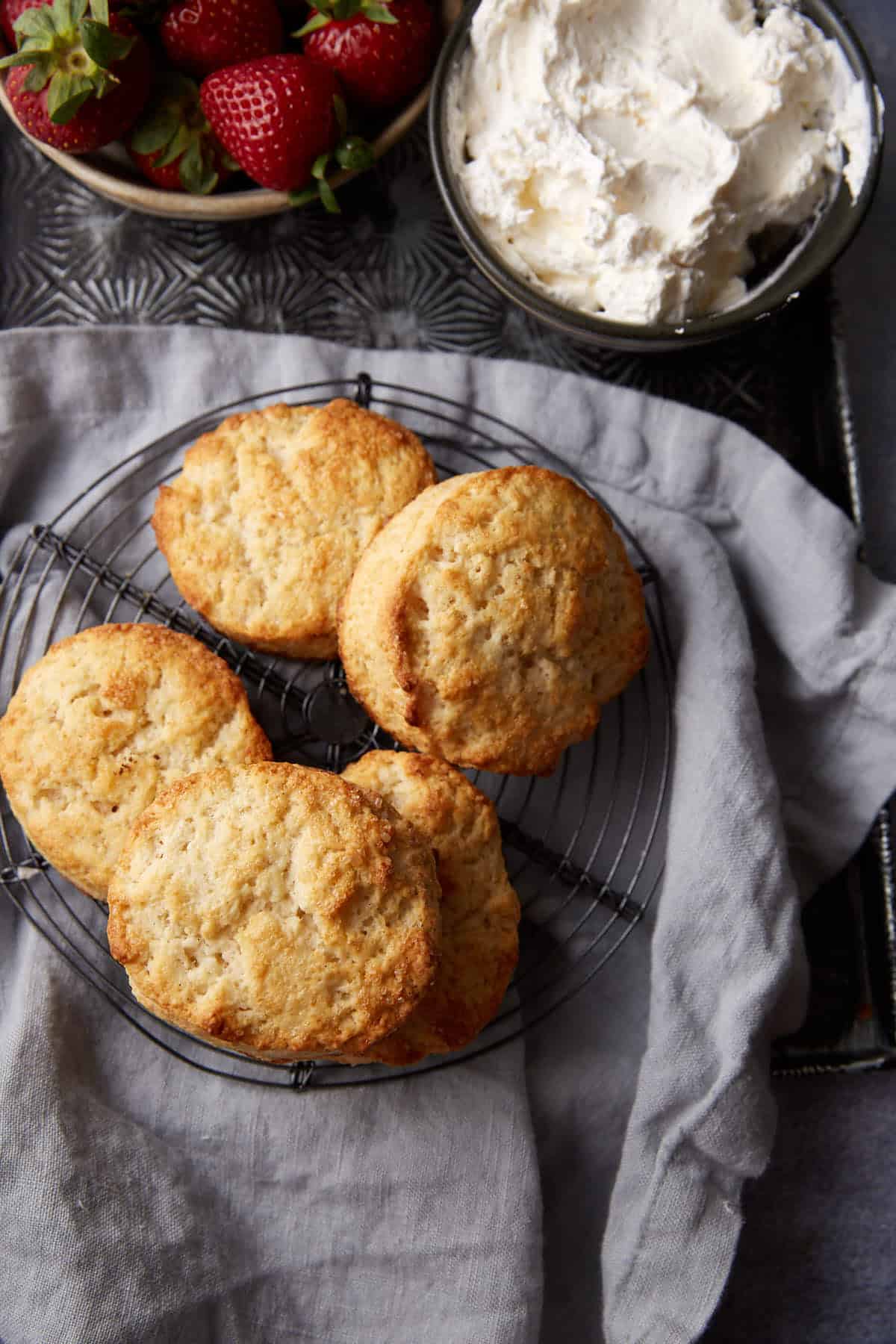 A batch of biscuits on a wire rack.