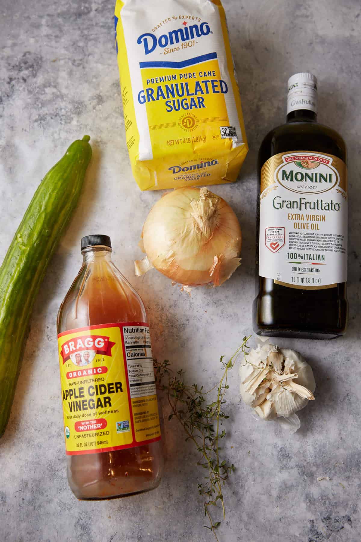 The ingredients needed to make a cucumber salad.