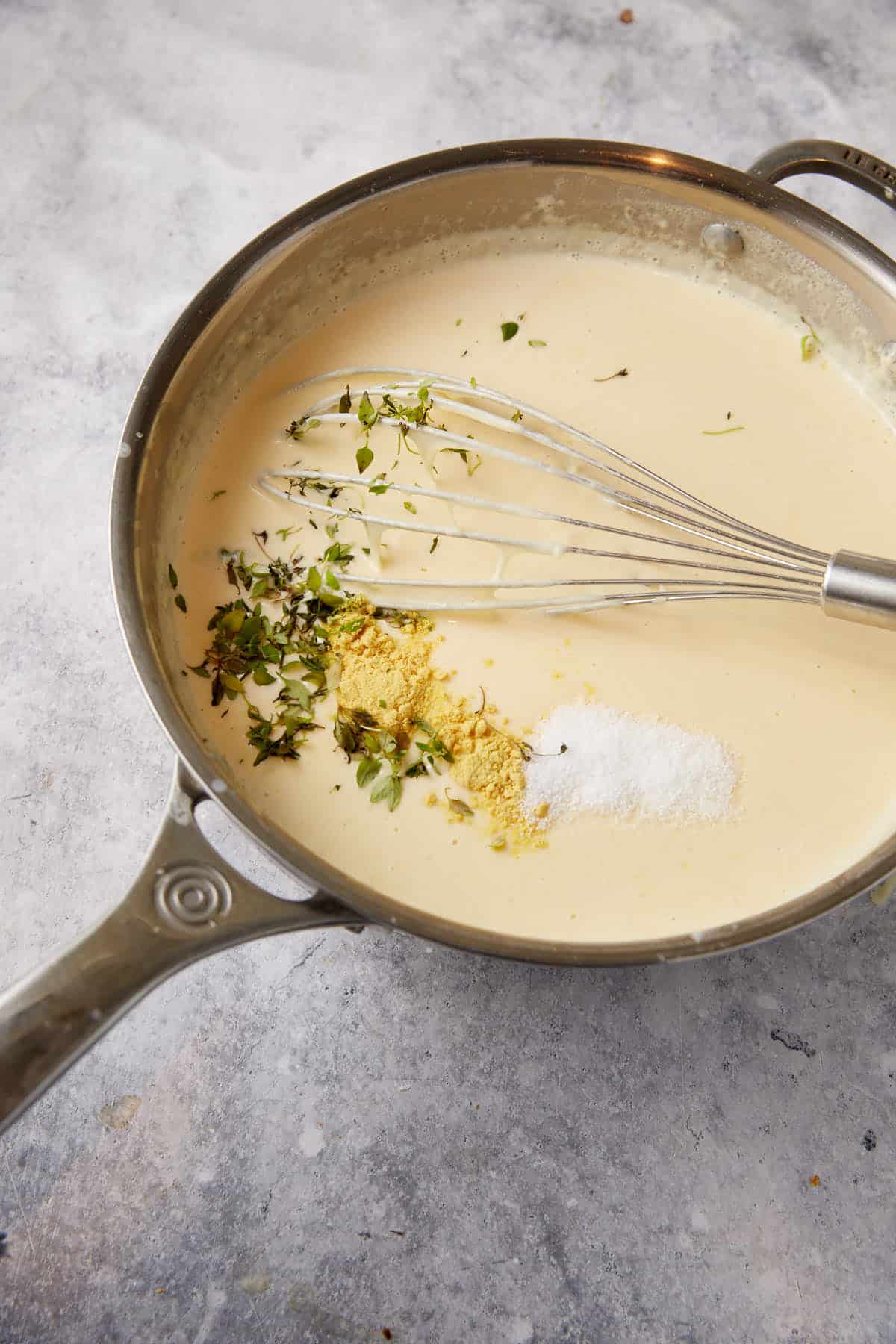 The seasonings added to the cheese sauce.