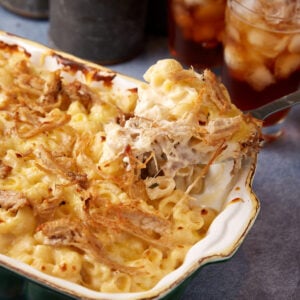 A spoon full of pork mac and cheese.