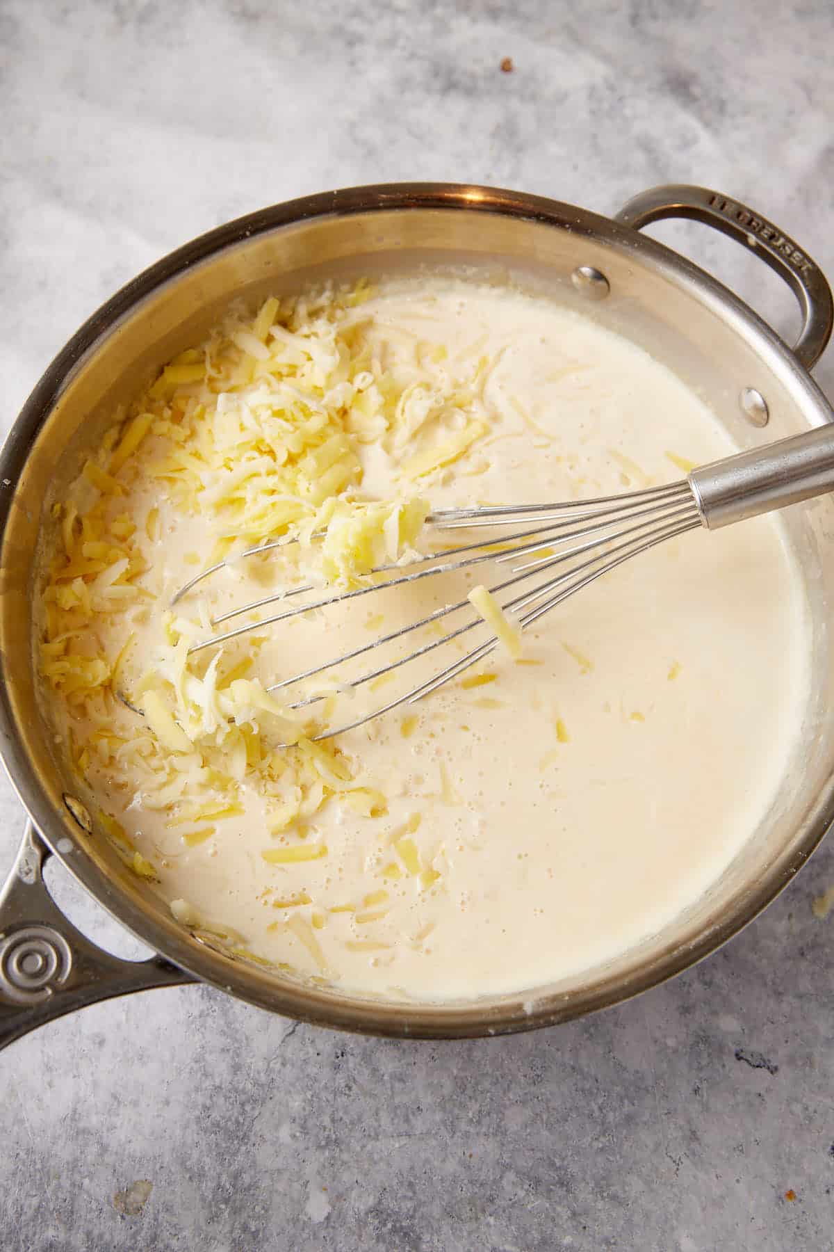 Cheese added to the cream sauce.