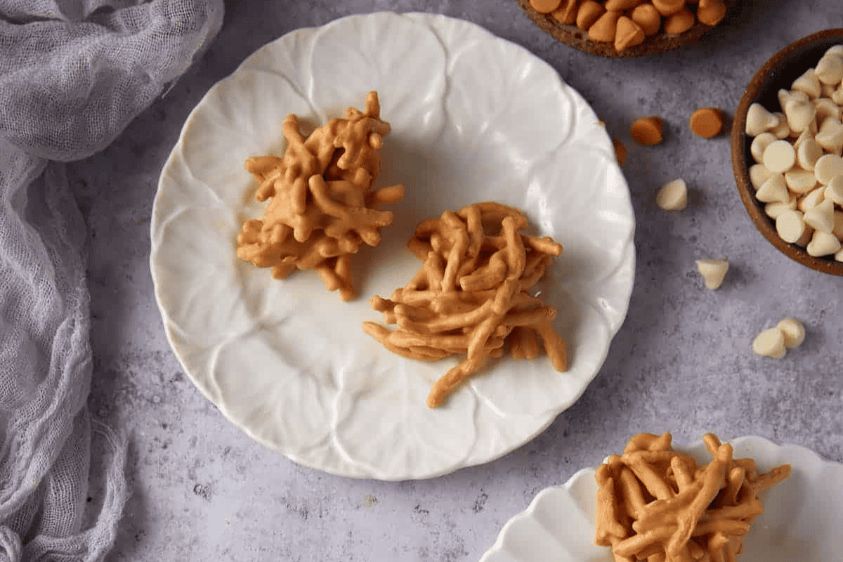 Haystack cookies on white plates.