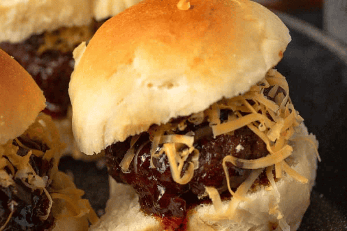 bourbon bergers on slider buns on a platter.
