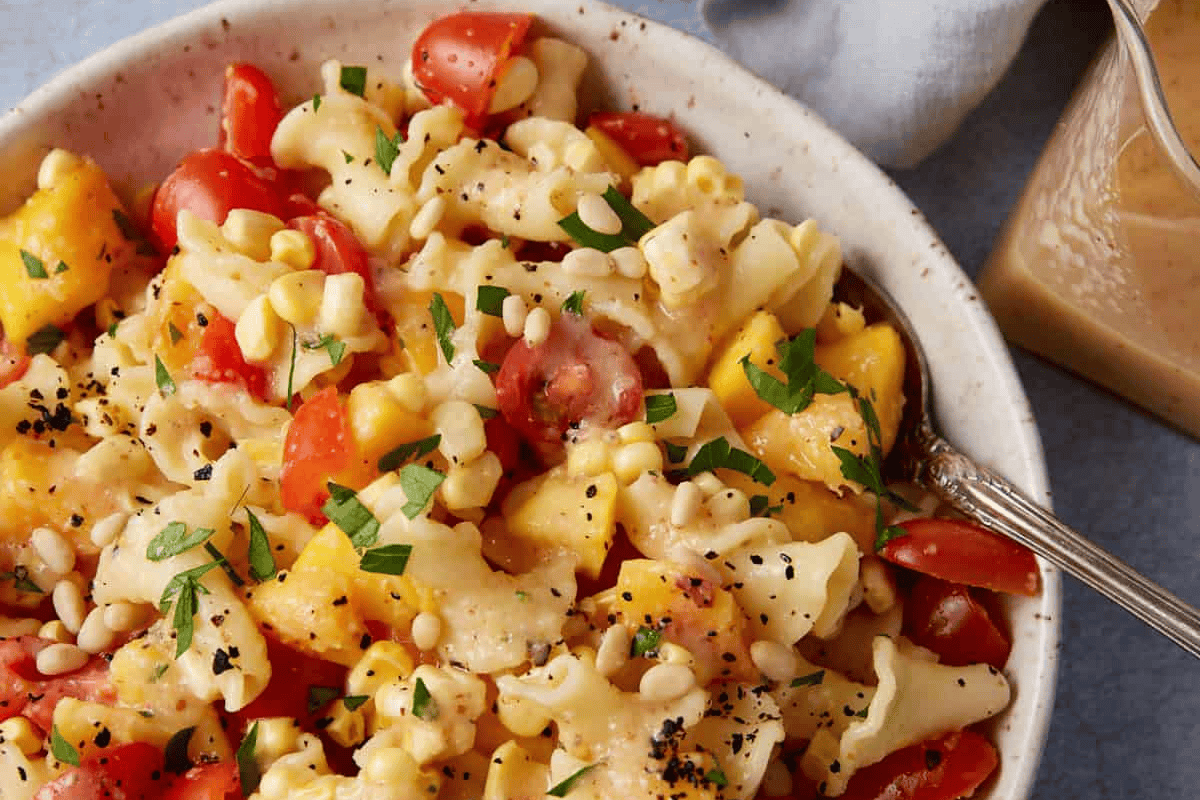 Peach pasta salad in a bowl.