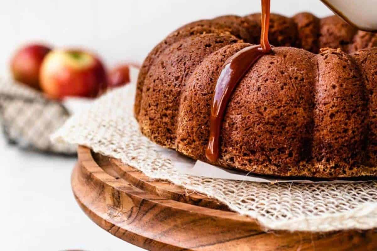 An apple cider cake on a platter