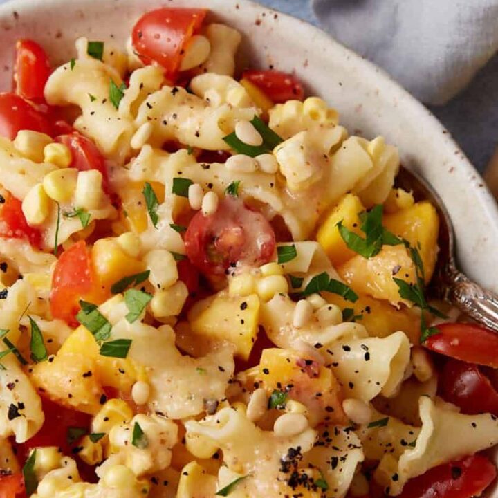 A bowl of peach pasta salad.