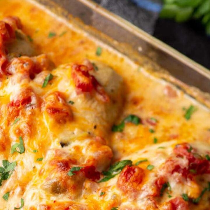 Queso chicken baked in a casserole dish.