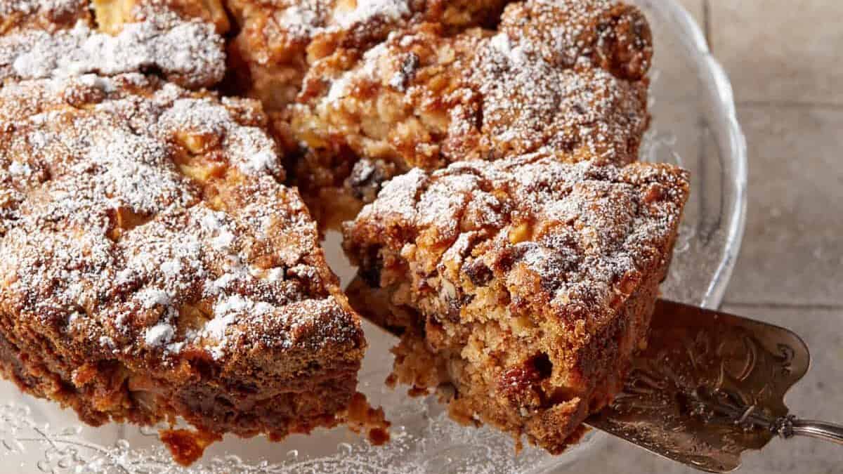 Cinnamon Apple Cake on a glass platter.