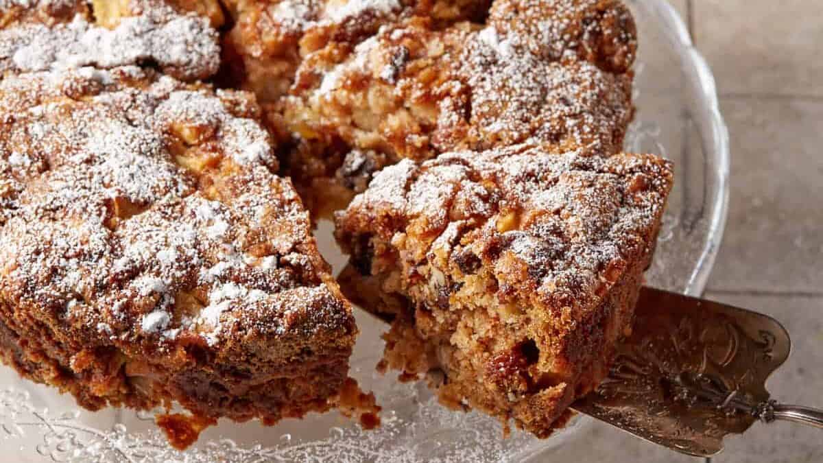 Cinnamon Apple Cake on a glass platter.