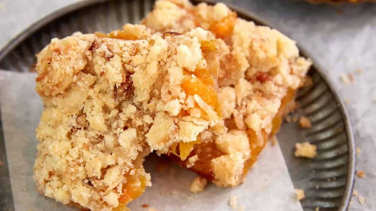 Two apricot cars on a plate.