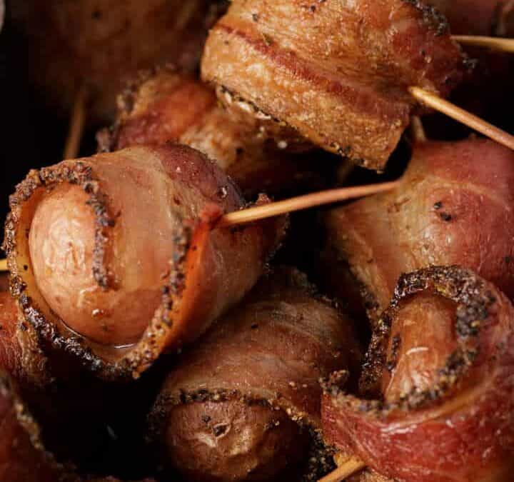 A platter of bacon wrapped potato bites.