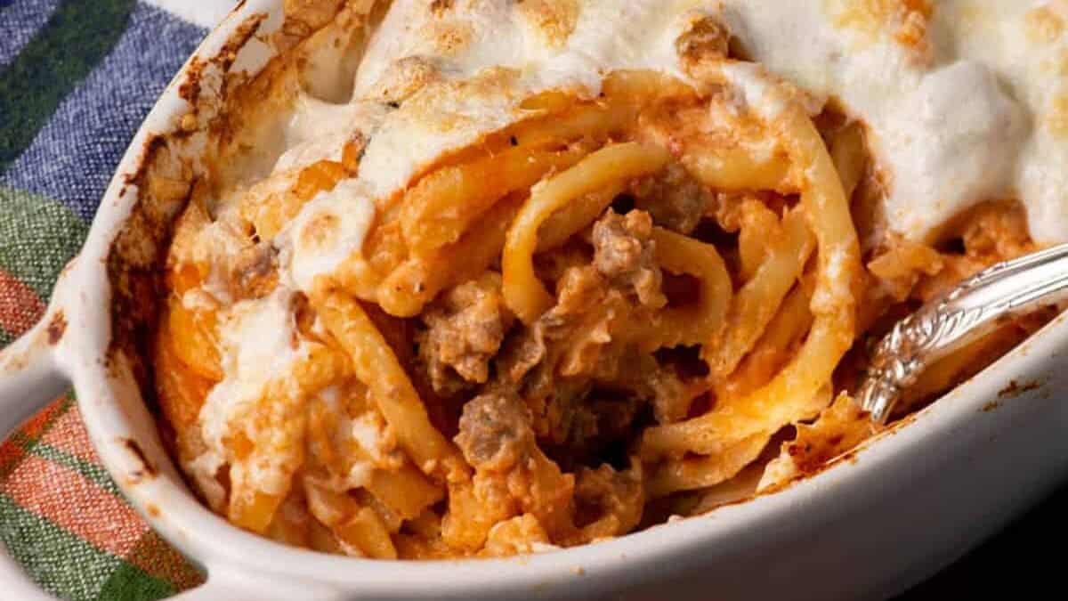A small casserole dish with baked spaghetti casserole.