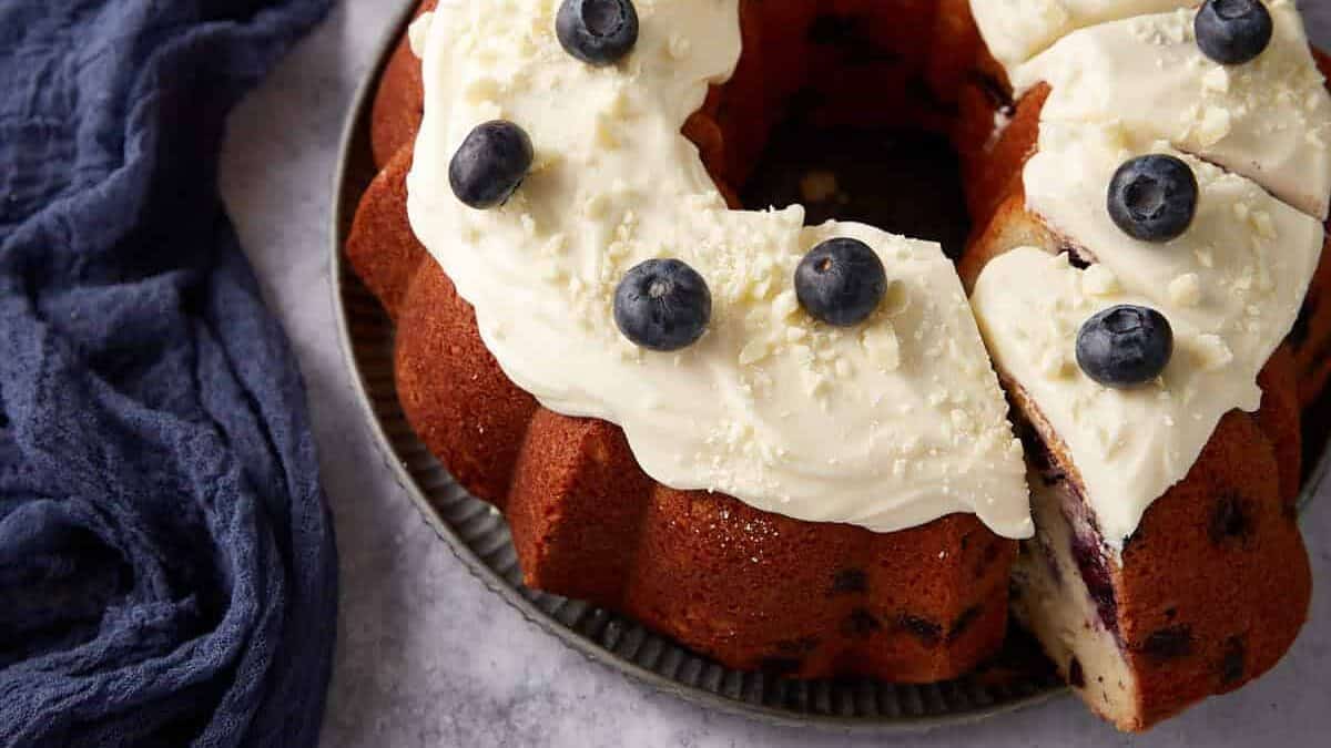 A frosted blueberry bundt cake.