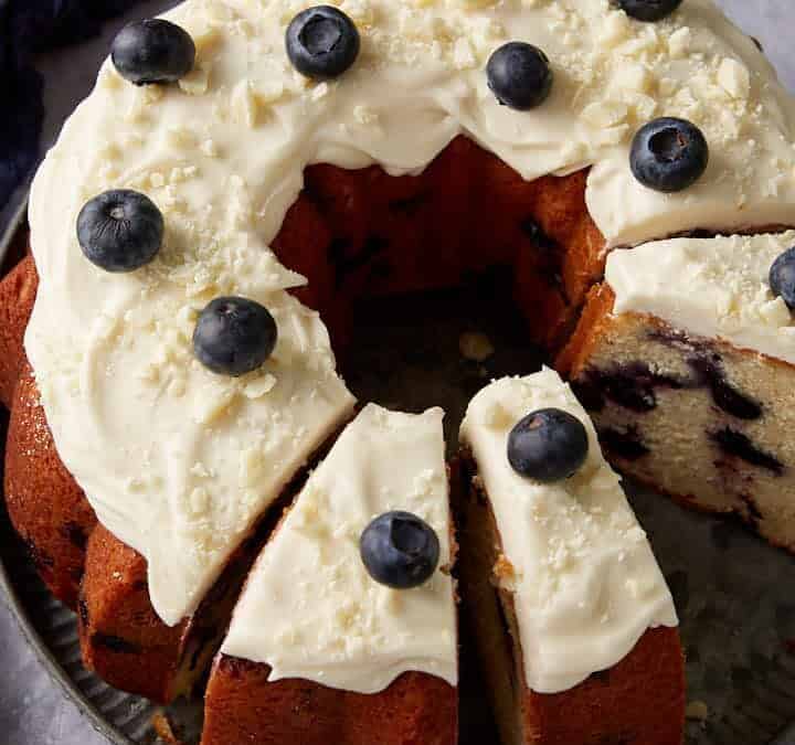 A blueberry bundt cake with frosting.