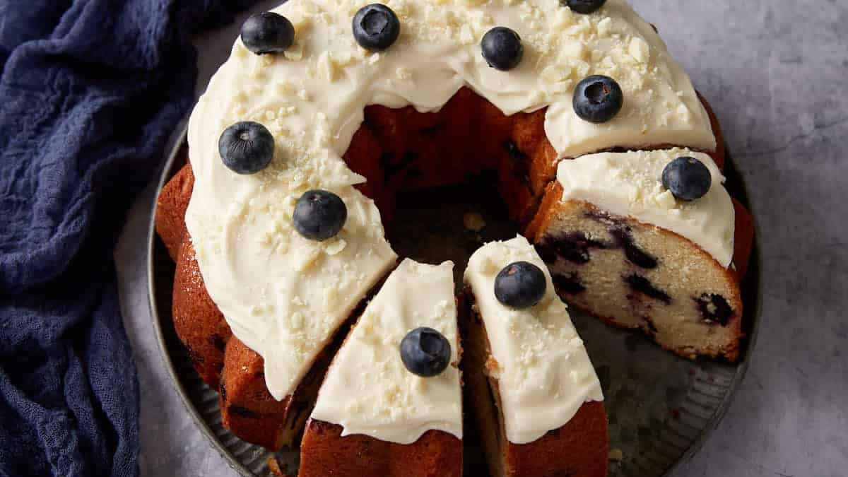 A blueberry bundt cake with frosting.