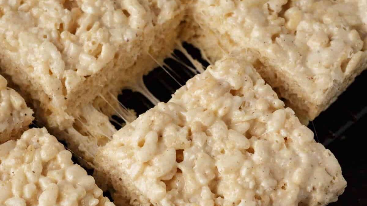 A brown butter Rice Krispie treat being pulled away from the rest.