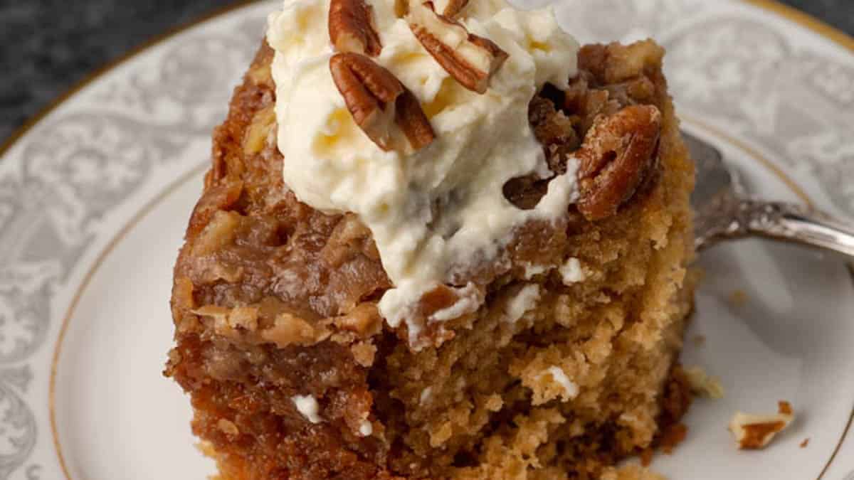 A square of cake with a bite taken out.