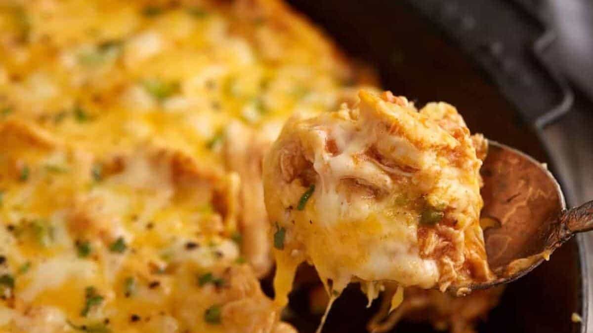 A spoon full of chicken tamale pie.