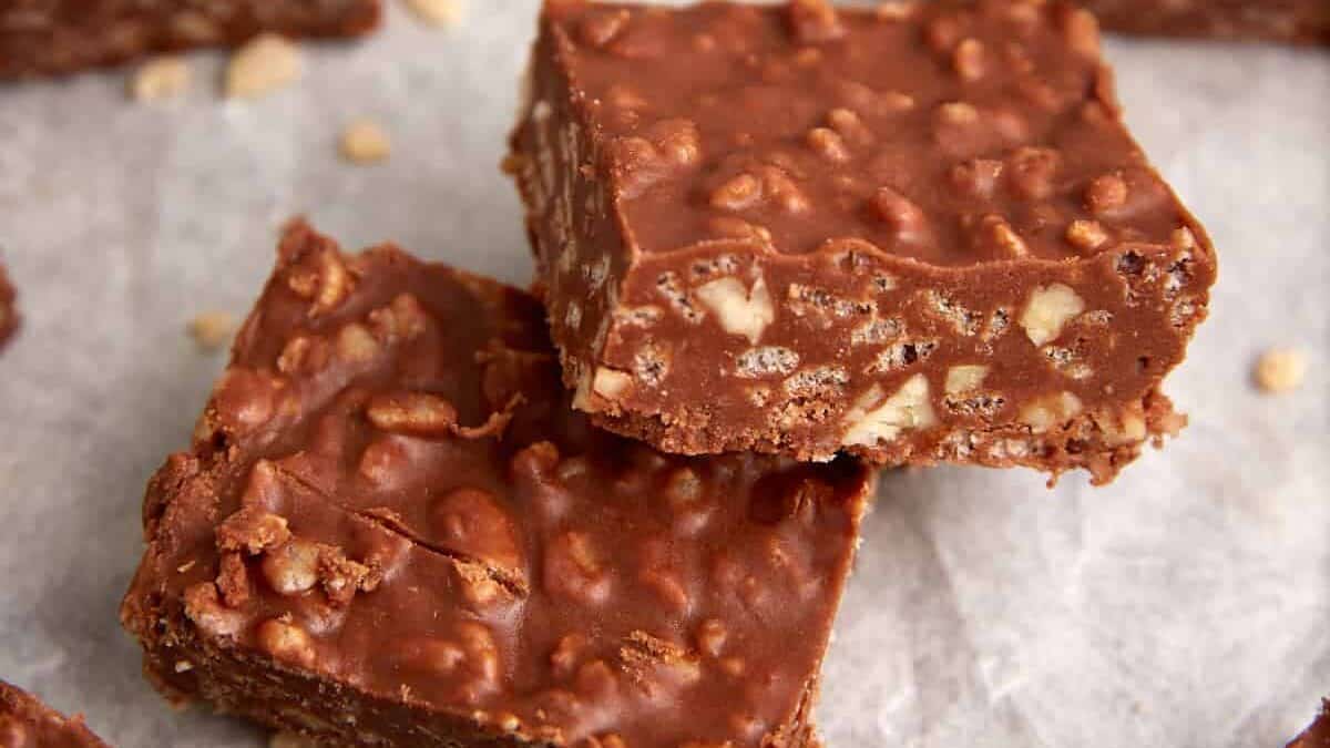 Peanut butter chocolate rice krispie squares stacked.