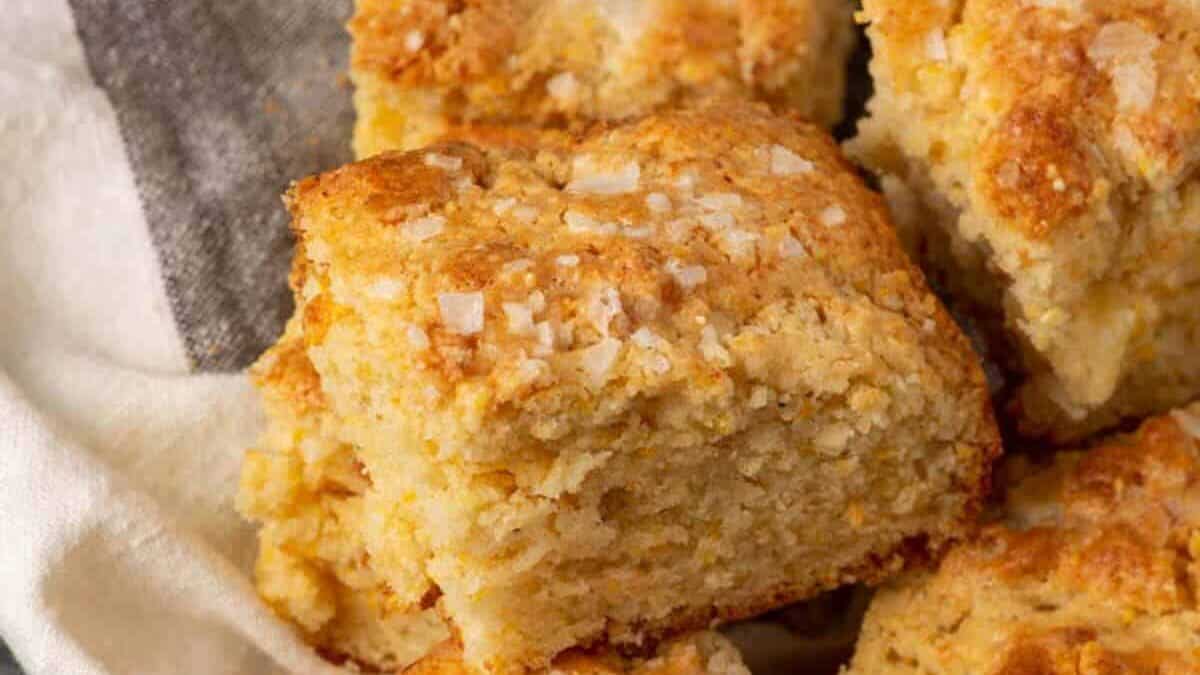 Squares of cornbread on a linen napkin.