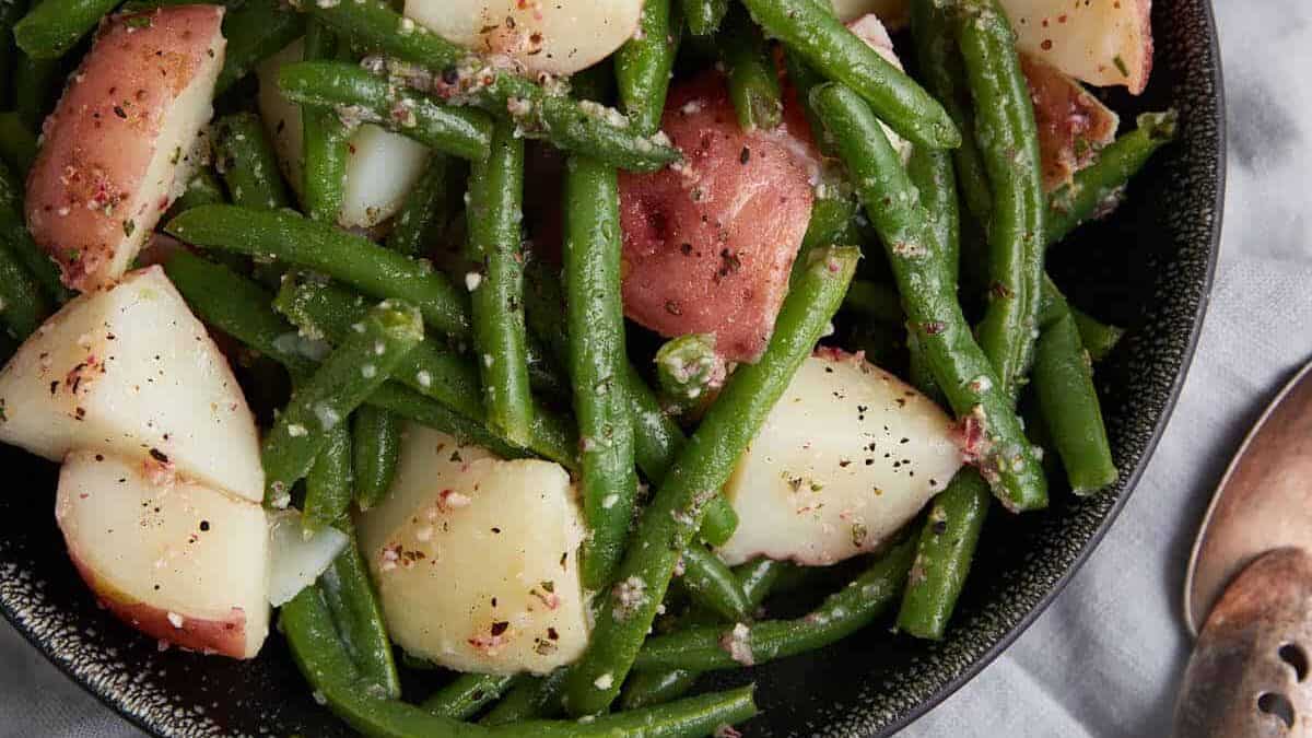 A platter of green bean and potato salad.