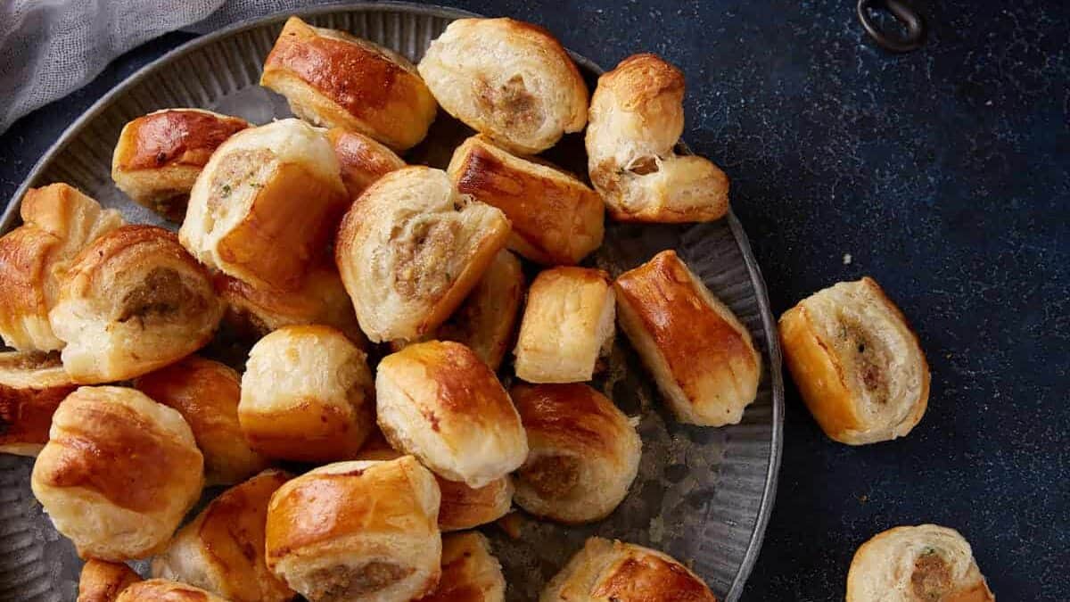 A platter of puff pastry sausage rolls.