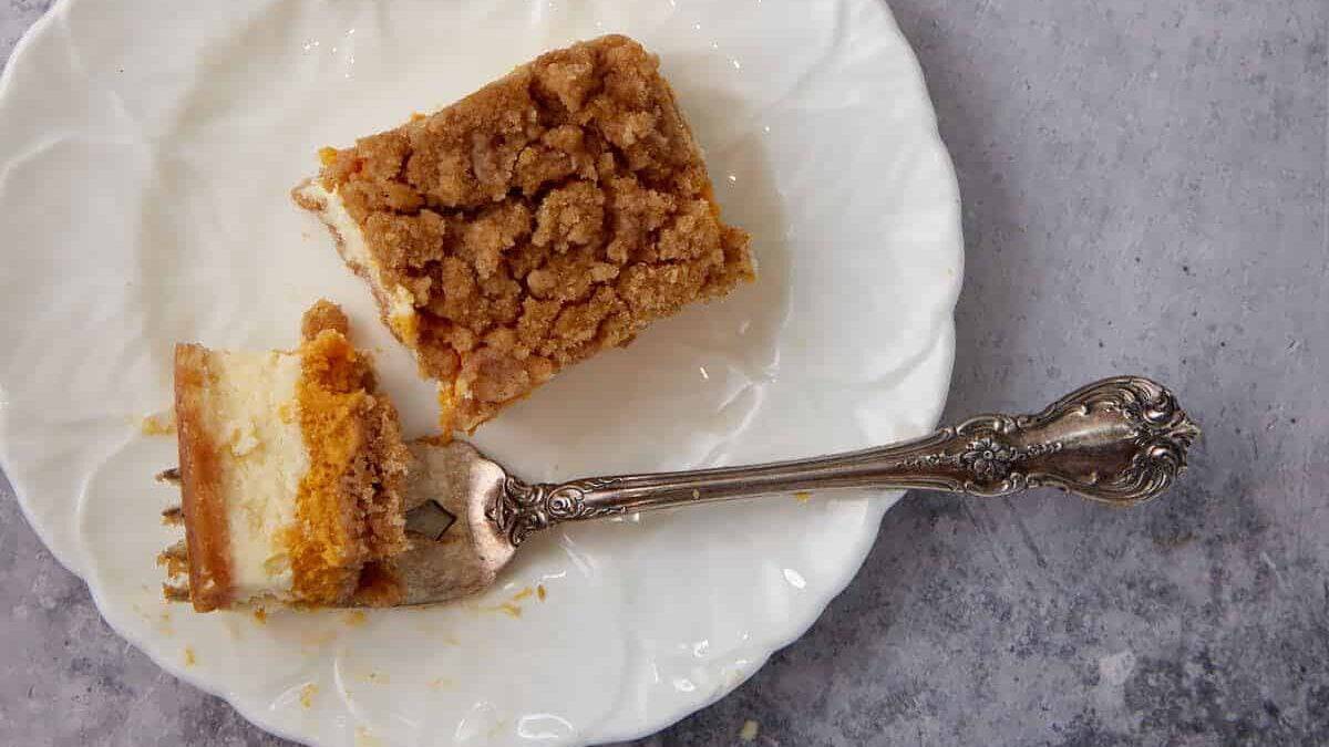 A pumpkin bar on a plate with a fork.
