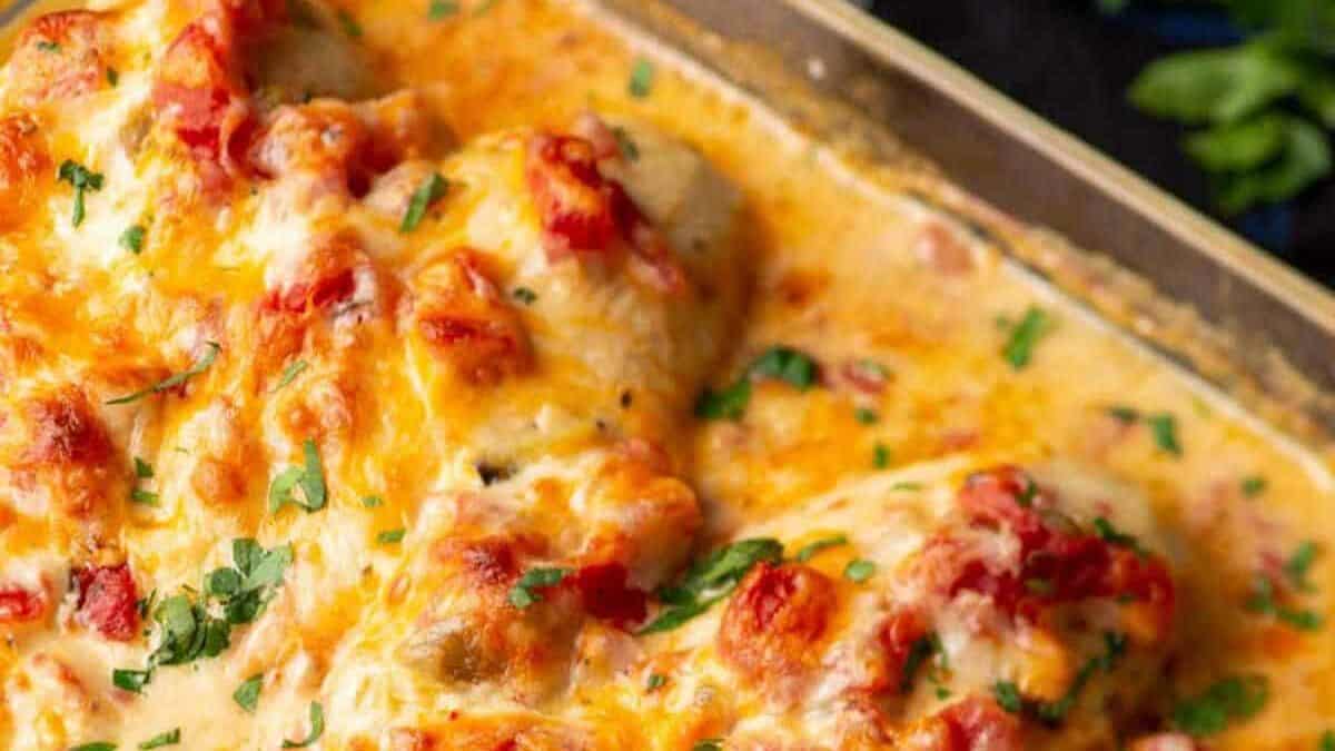 Queso chicken baked in a casserole dish.