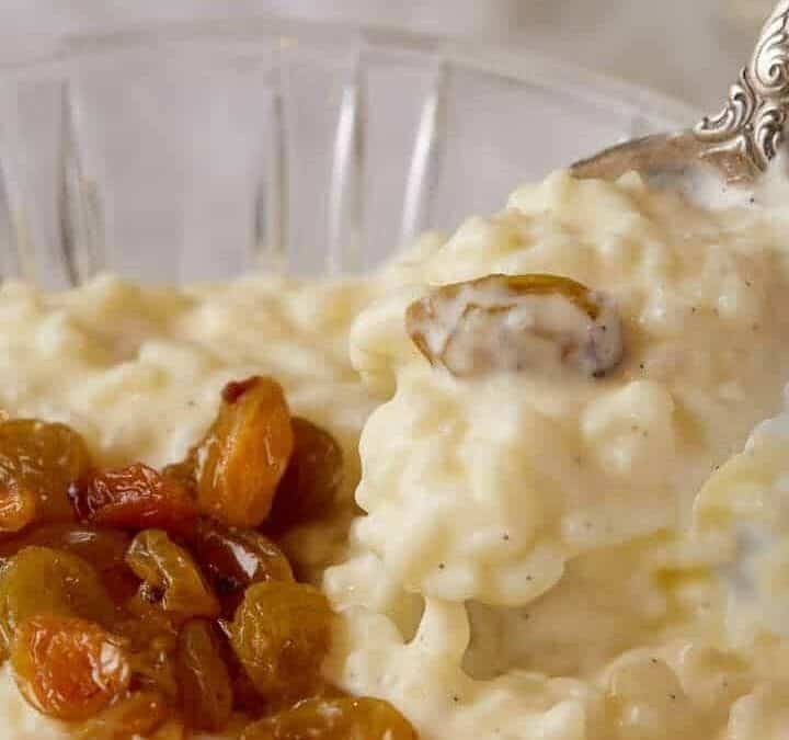 A spoon full of homemade rice pudding.