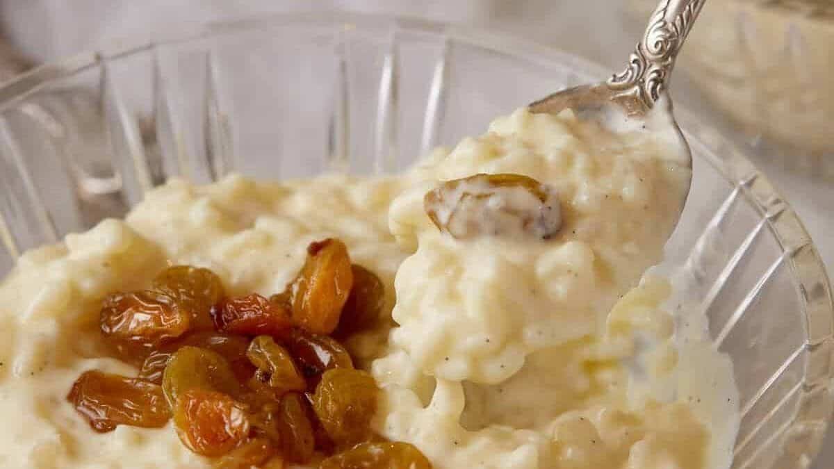 A spoon full of homemade rice pudding.