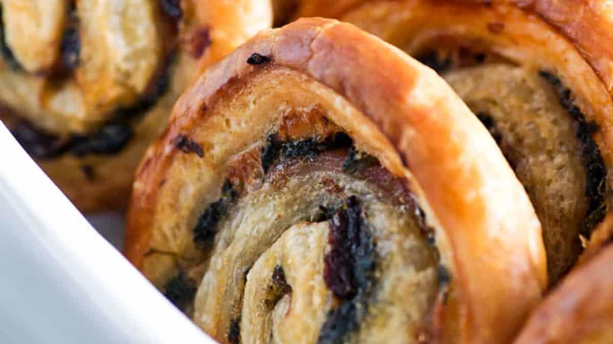 A serving dish of puff pastry appetizers.