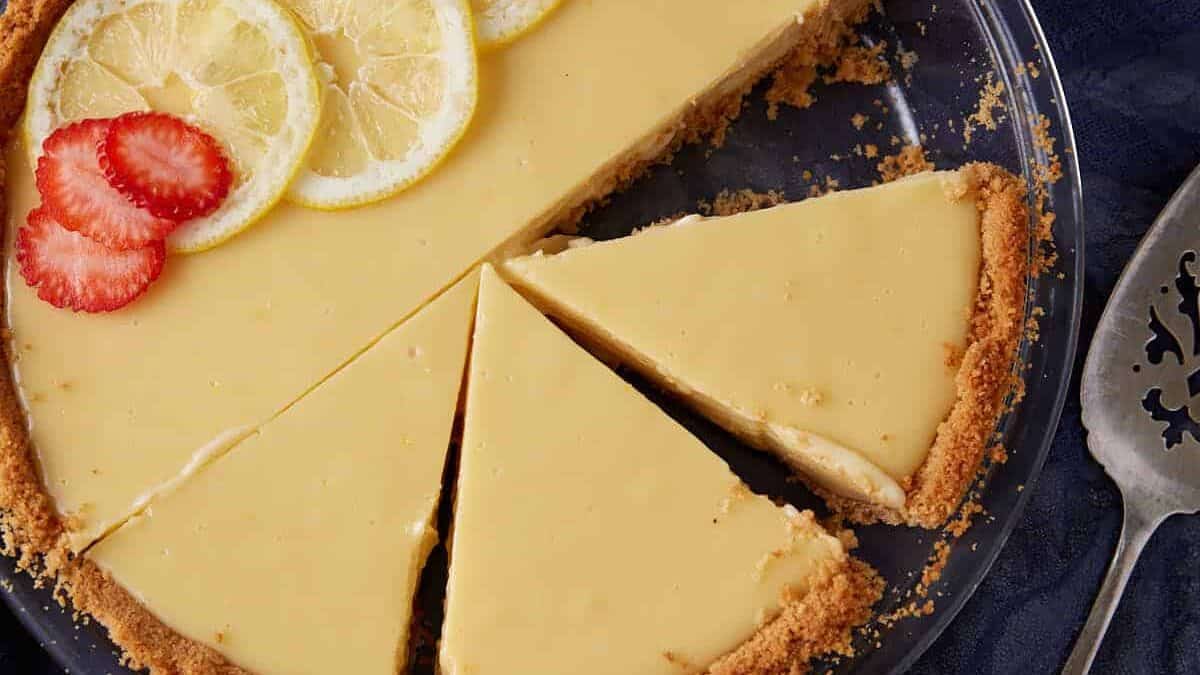A Lemonade pie topped with strawberries.
