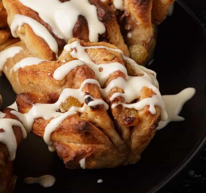 apple cinnamon rolls with plates and forks
