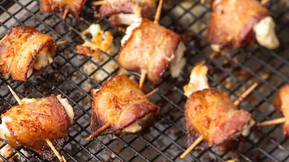 Baked chicken bites on a wire rack.