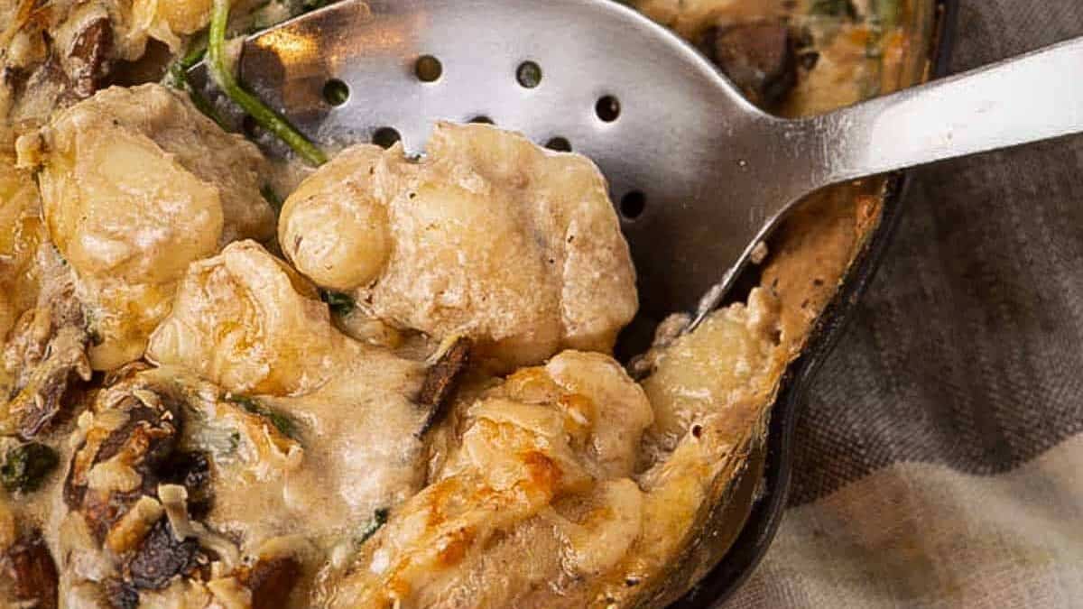 An iron skillet with baked gnocchi