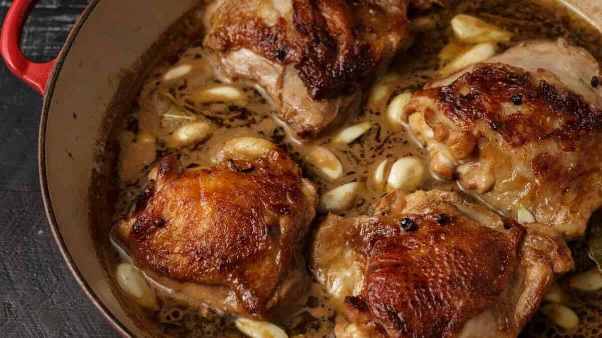 Chicken and marinade in a skillet