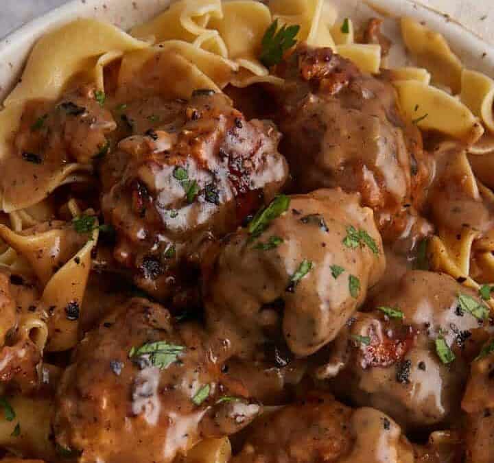 A platter of chicken meatballs in Marsala sauce.